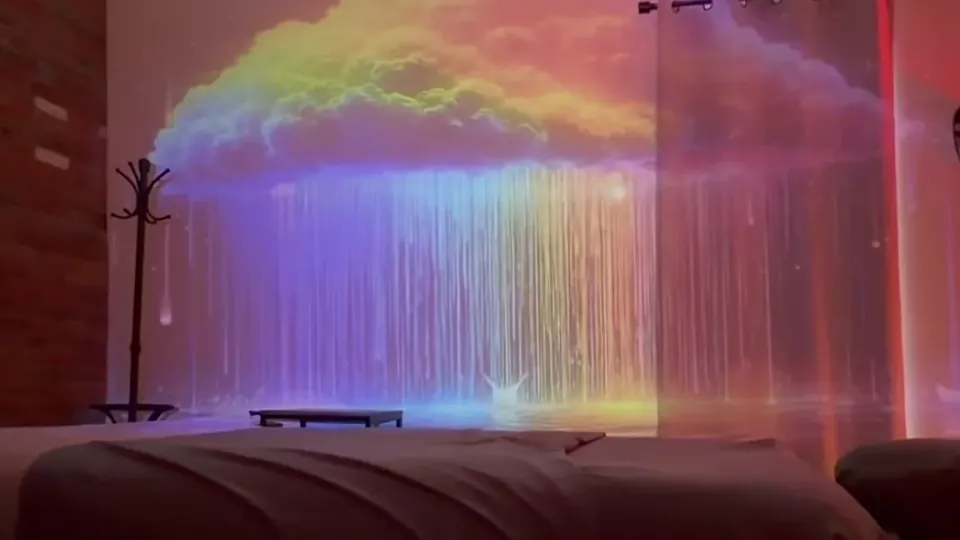 A quiet view of the Serenity treatment room with moving cloud and rain lighting