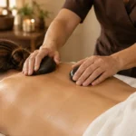 Illustration of smooth massage stones and neatly folded towels